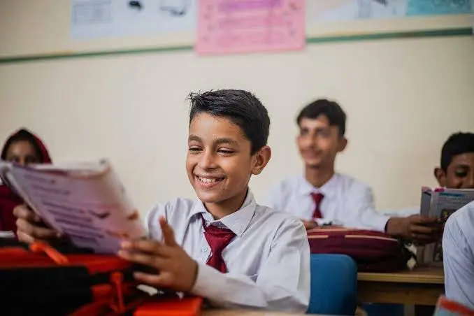 Students in a classroom representing education’s role in shaping social values and challenging harmful social norms.
